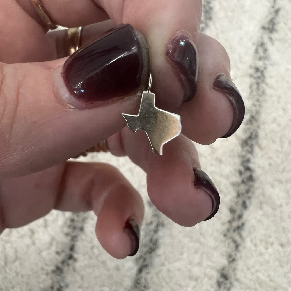 Tiny Texas charm.  Silver or WG?
